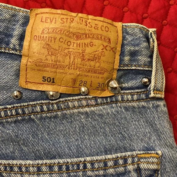 Vintage Levi’s redesign by Charlotte f with real feather detail o de legs sides